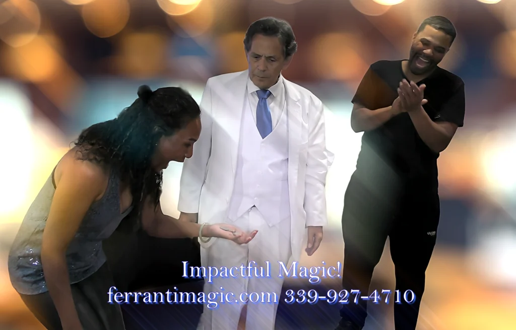 The Best in Magic Entertainment Photo of Boston Massachusetts Magician joe Ferranti performing his MagicComedy Show with two assisting spectators both are laughing surprised and clapping