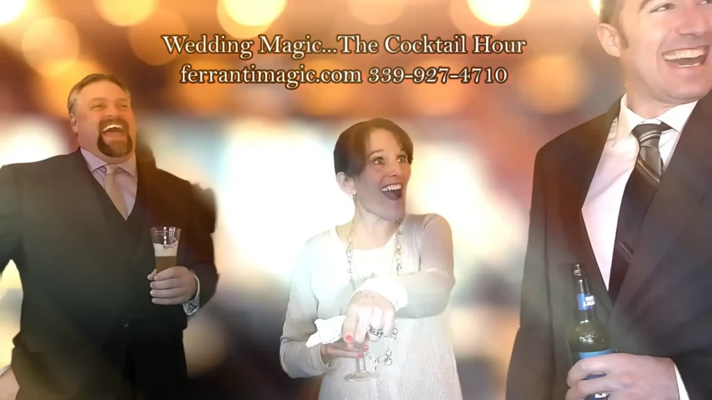 weddingmagicianbostonmassachusetts The Best in Magic Entertainment The Best in Magic Entertainment Laughing and smiling spectators enjoying the magic of Joe Ferranti during a wedding cocktail hour