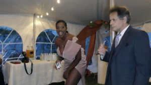Guests reacting as a close-up magician performs at a Massachusetts private event