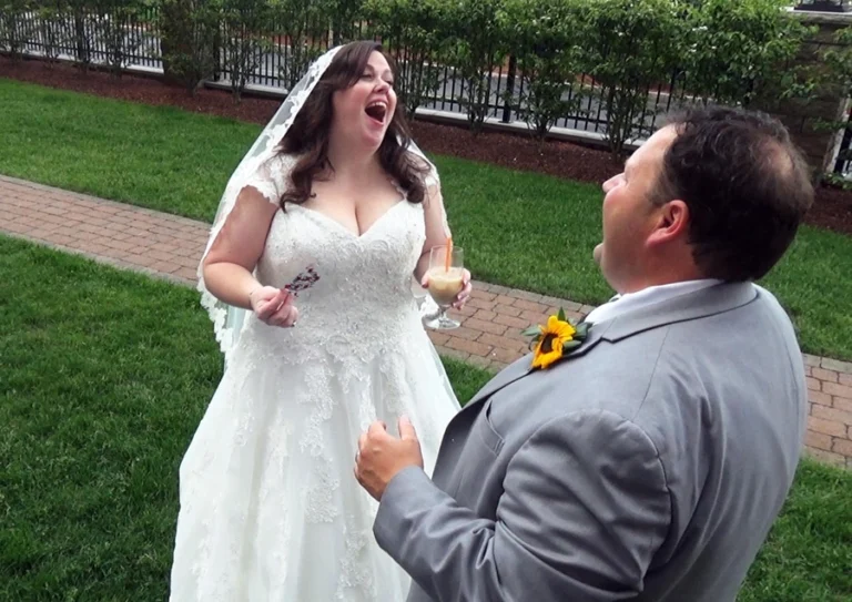 A wedding couple sharing a fun close‑up magic moment during their Boston‑area celebration.